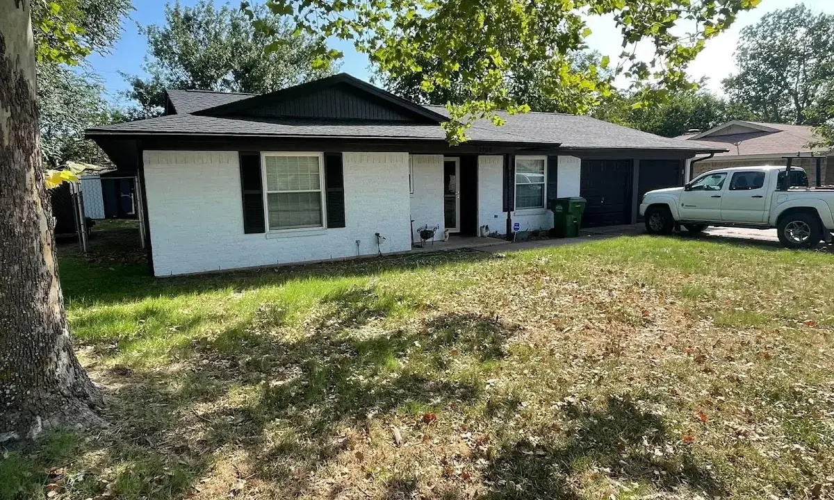 Professional roofing crew working on a residential roof in Stickney